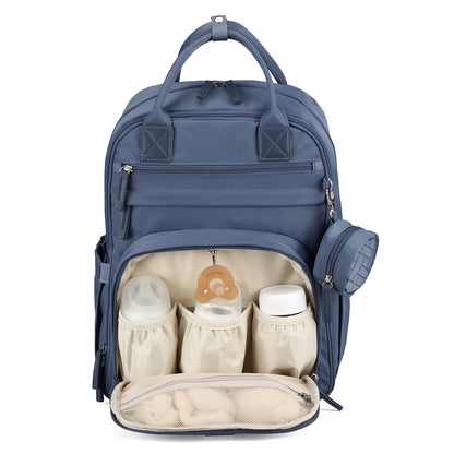 Brisby Premium Luiertas – Uitgebreide en Functionele Verzorgingstas – met buggymontage – Anti Diefstal Vakken - Reistrolley Sleeve - Inclusief verschoonmatje t.w.v.15,99 euro en speenhouder - Levenslange Garantie - Nordic Blue