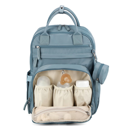 Brisby Premium Luiertas – Uitgebreide en Functionele Verzorgingstas – met buggymontage – Anti Diefstal Vakken - Reistrolley Sleeve - Inclusief verschoonmatje t.w.v.15,99 euro en speenhouder - Levenslange Garantie - Misty Blue